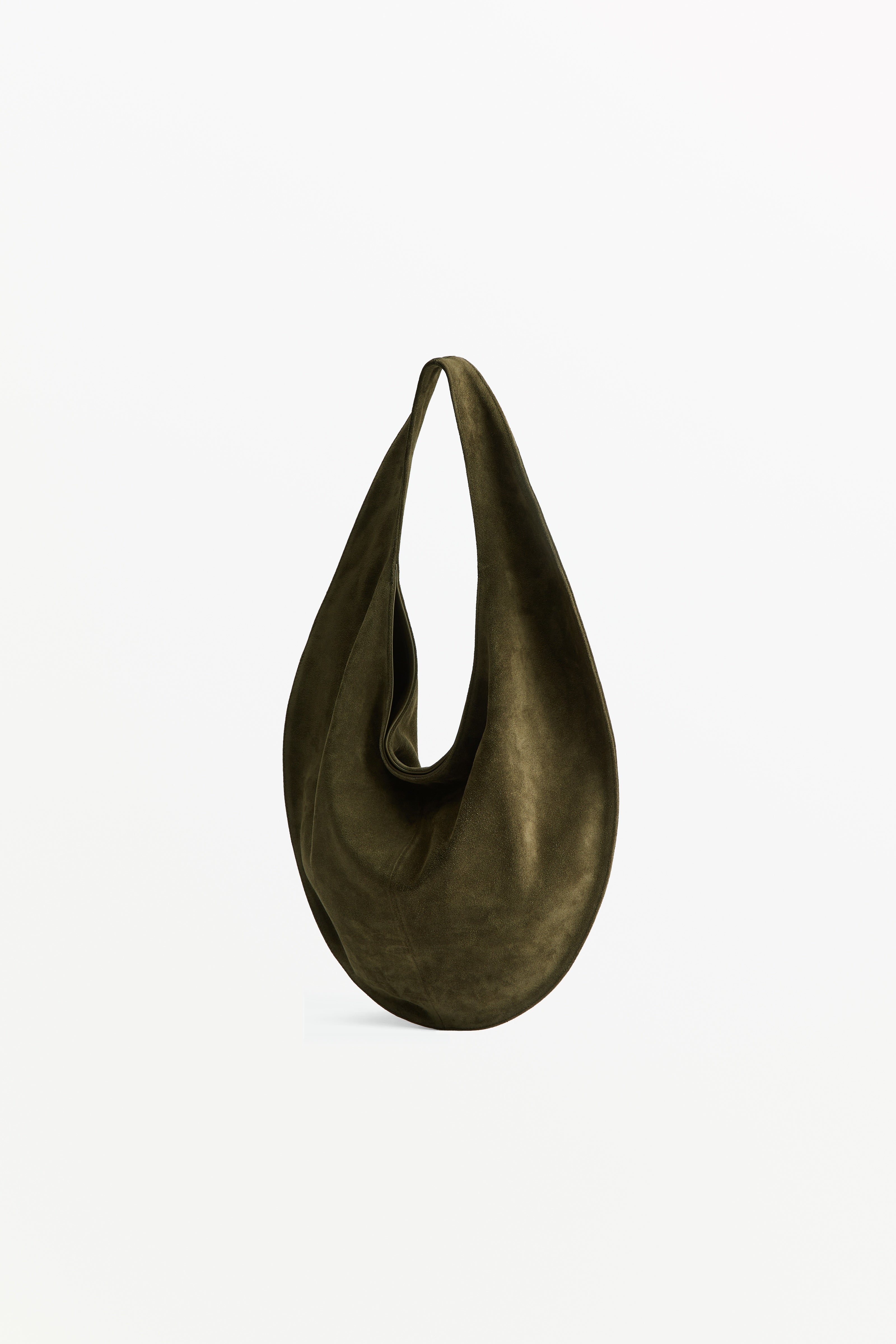 Market Tote Suede Kelp, worn on the shoulder