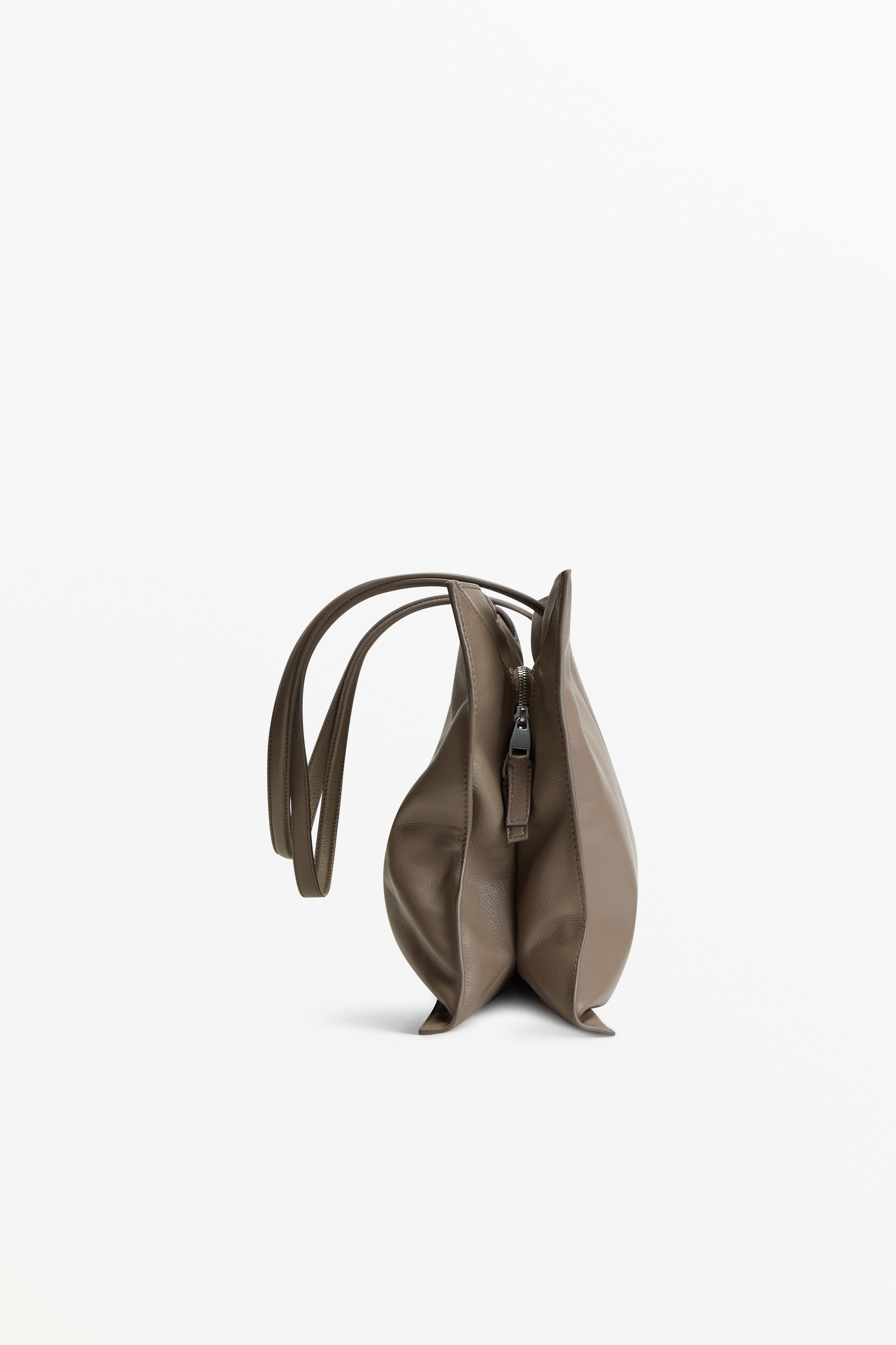 Yumi Sling Mute, profile view